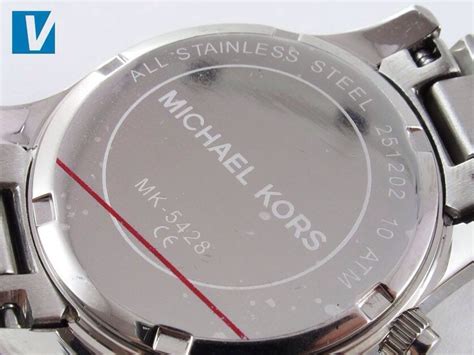 how do you tell a fake michael kors watch|michael kors watch serial number look.